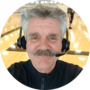 a man wearing a headset smiling