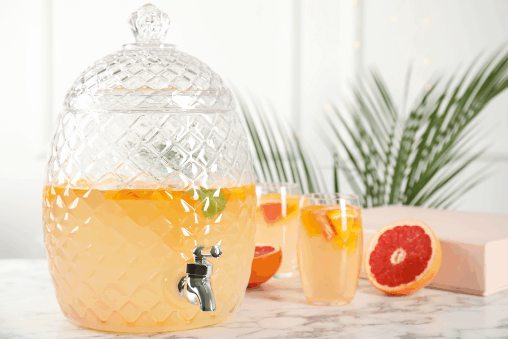 Photo of an elegant beverage station with various drink options clearly displayed, garnishes, and attractive glassware