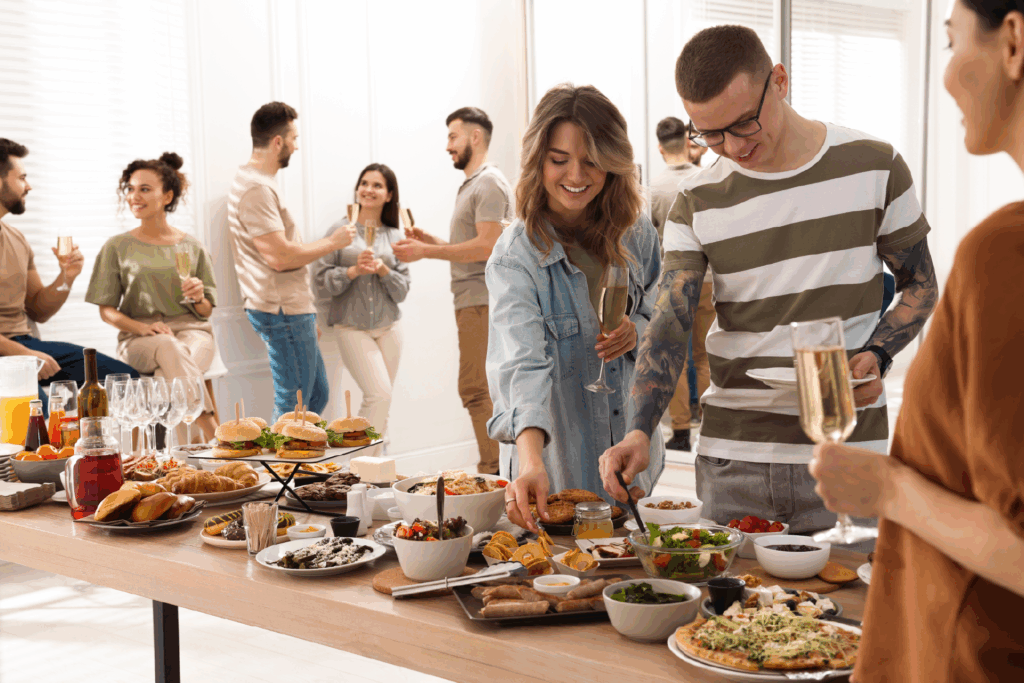 buyers at a home seller open house with a variety of food options 